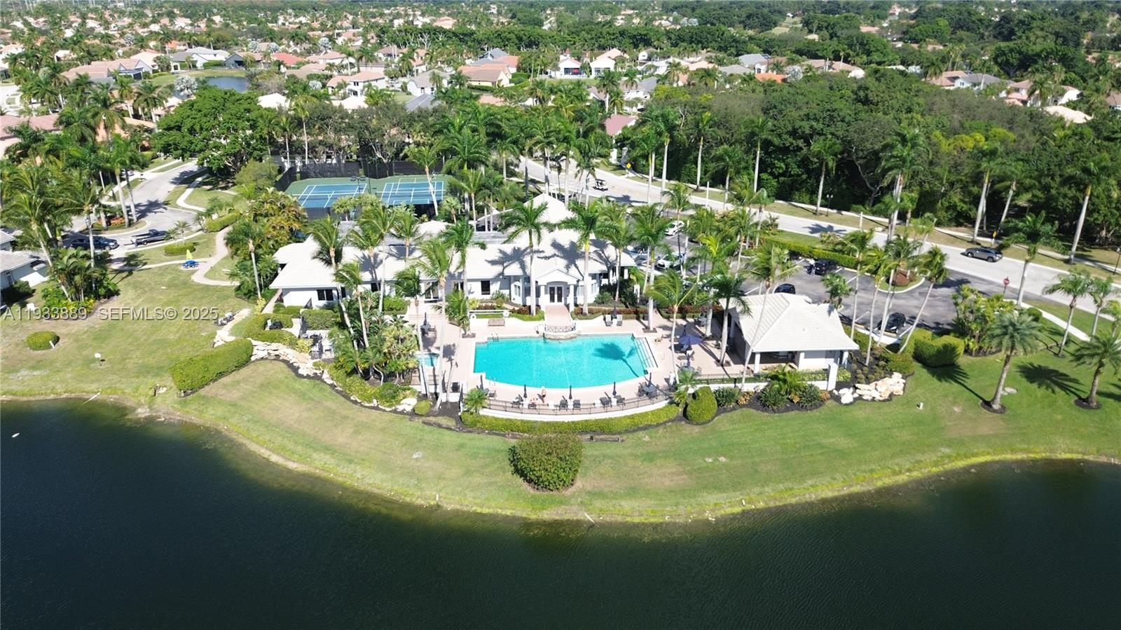 19754 Dinner Key Drive Boca Raton, FL 33498 - Photo 30 of 48 a view of a lake with a yard