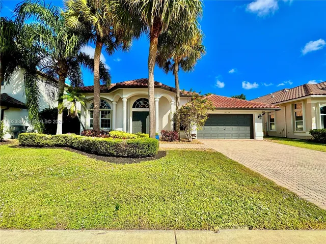 a front view of a house with swimming pool having outdoor seating