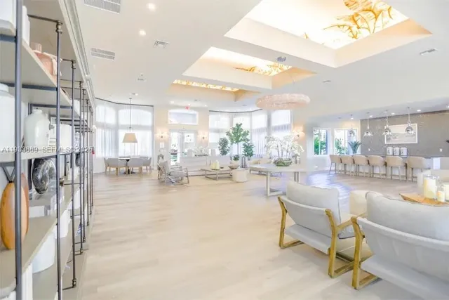 a area with lots of chairs and mirrors