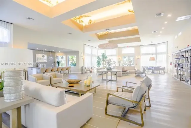 a lobby with furniture and a chandelier