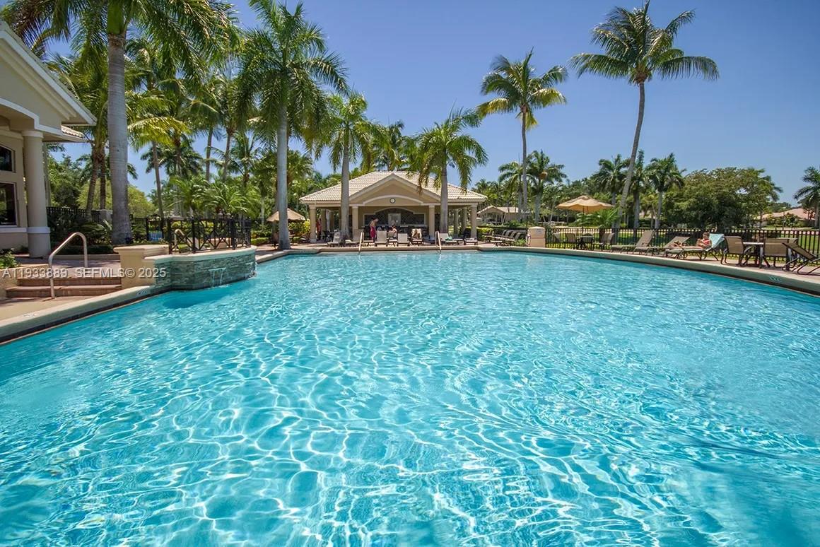 19754 Dinner Key Drive Boca Raton, FL 33498 - Photo 42 of 48 a front view of a house with garden
