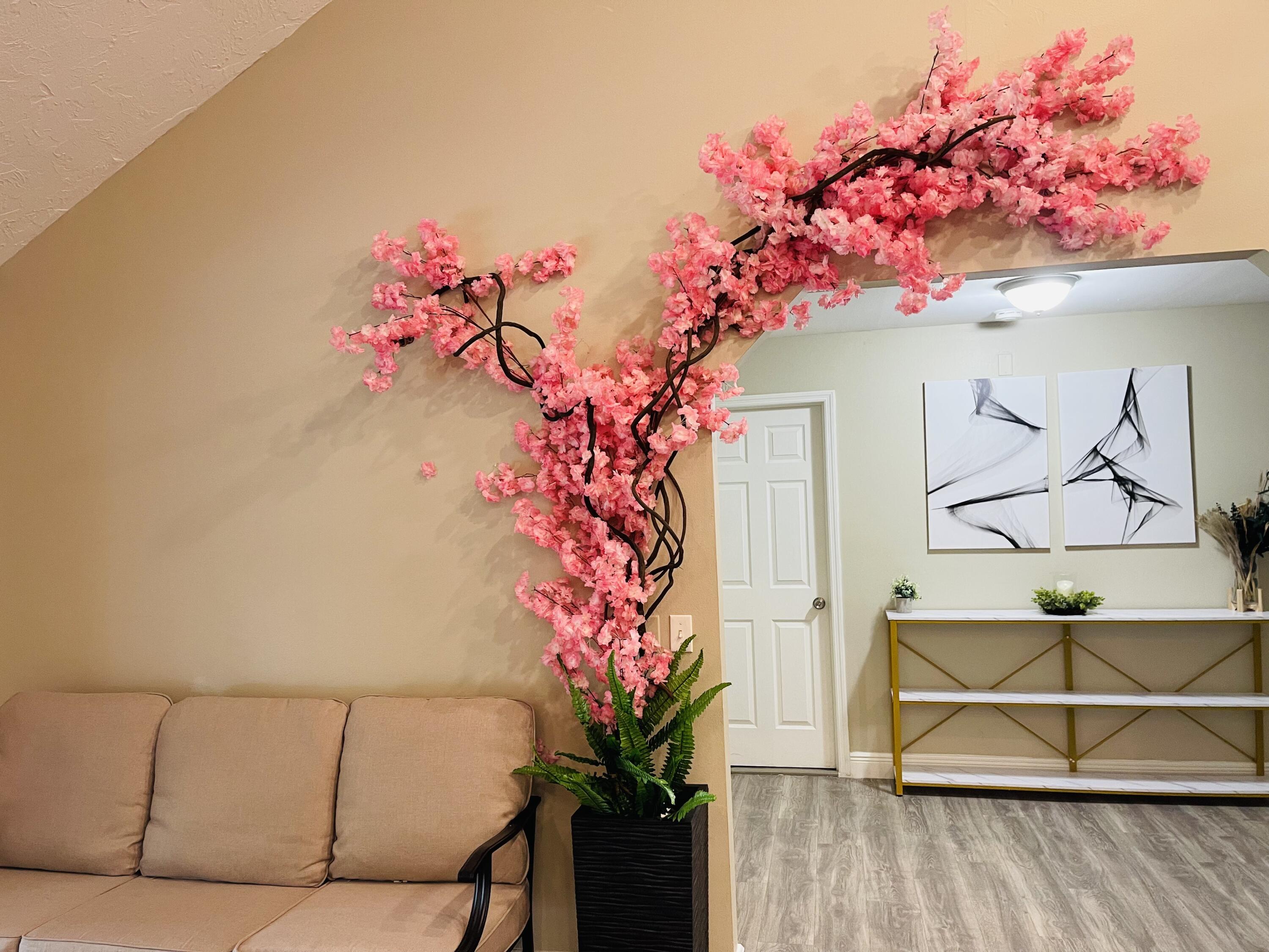 9296 166th Way North Jupiter, FL 33478 - Photo 13 of 31 a vase with flowers sitting on a table with potted plant