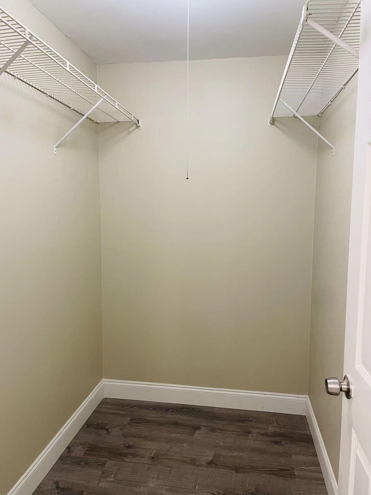 9296 166th Way North Jupiter, FL 33478 - Photo 17 of 31 a view of a room with racks on the wall