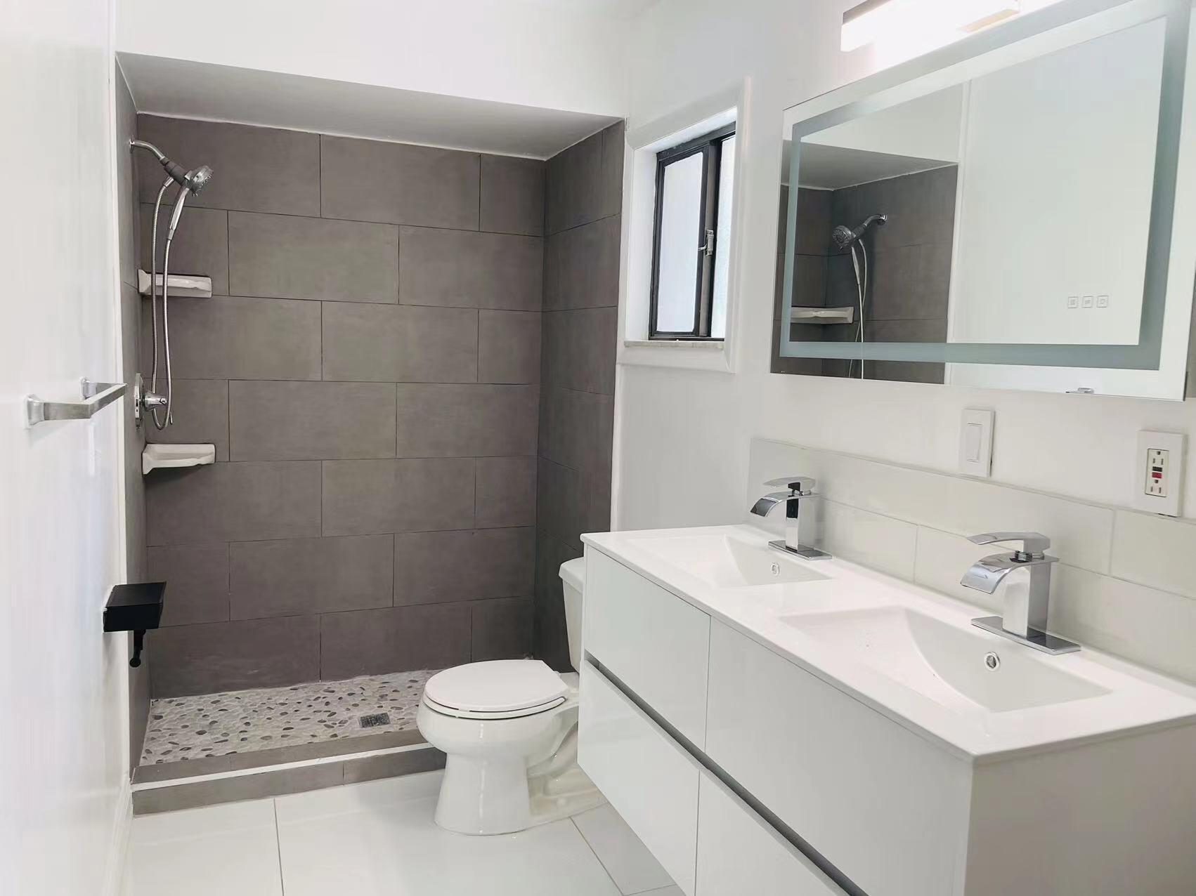 9296 166th Way North Jupiter, FL 33478 - Photo 18 of 31 a bathroom with a sink toilet and shower