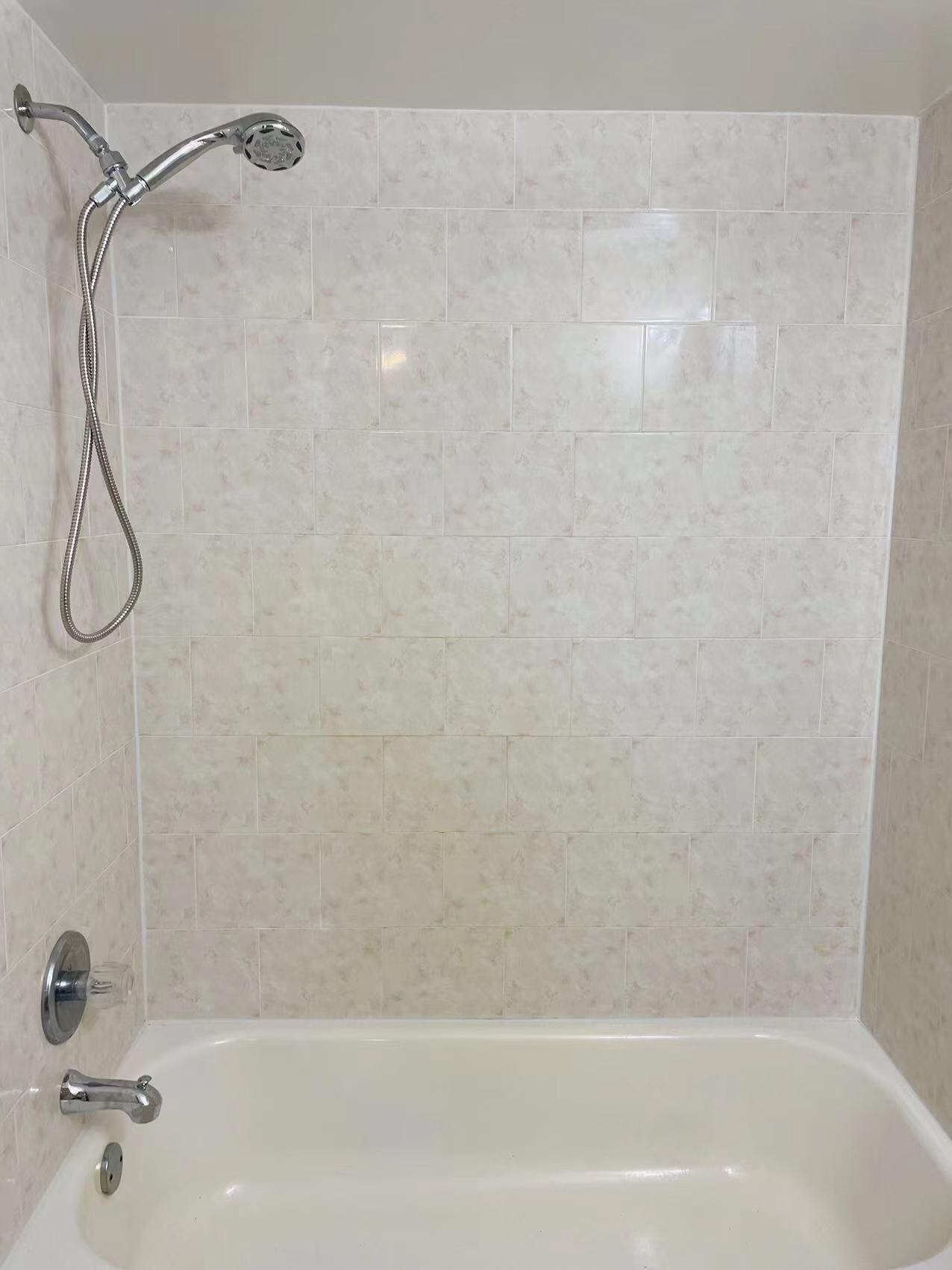 9296 166th Way North Jupiter, FL 33478 - Photo 19 of 31 a bathroom with a bath tub with a shower