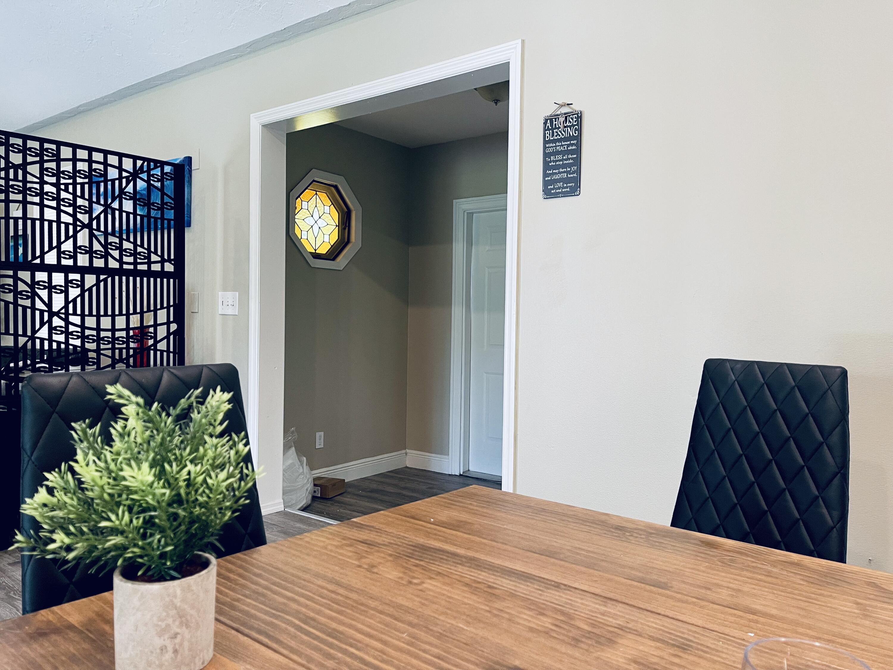 9296 166th Way North Jupiter, FL 33478 - Photo 5 of 31 a bedroom with a bed and a potted plant