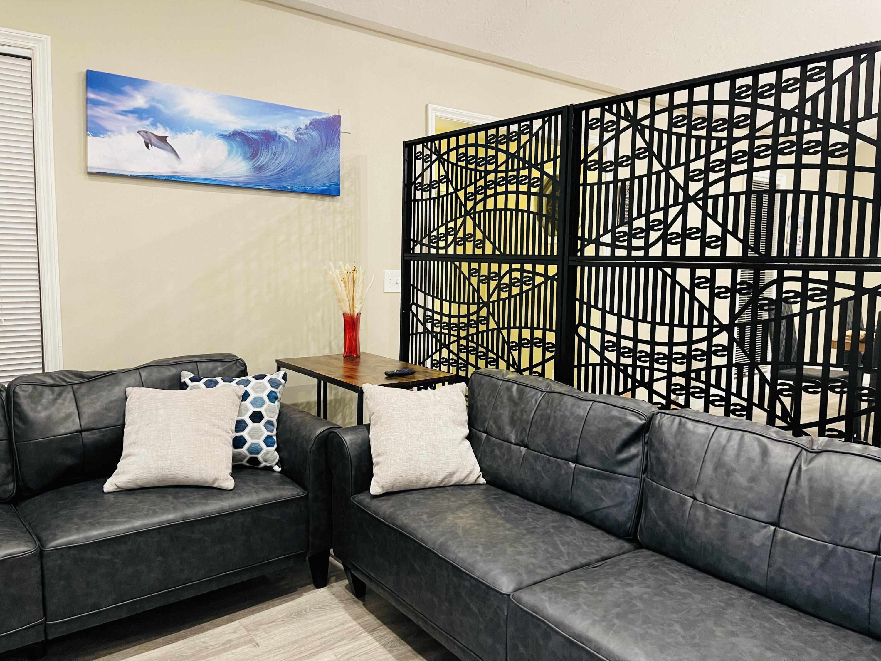 9296 166th Way North Jupiter, FL 33478 - Photo 10 of 31 a living room with furniture and a couch