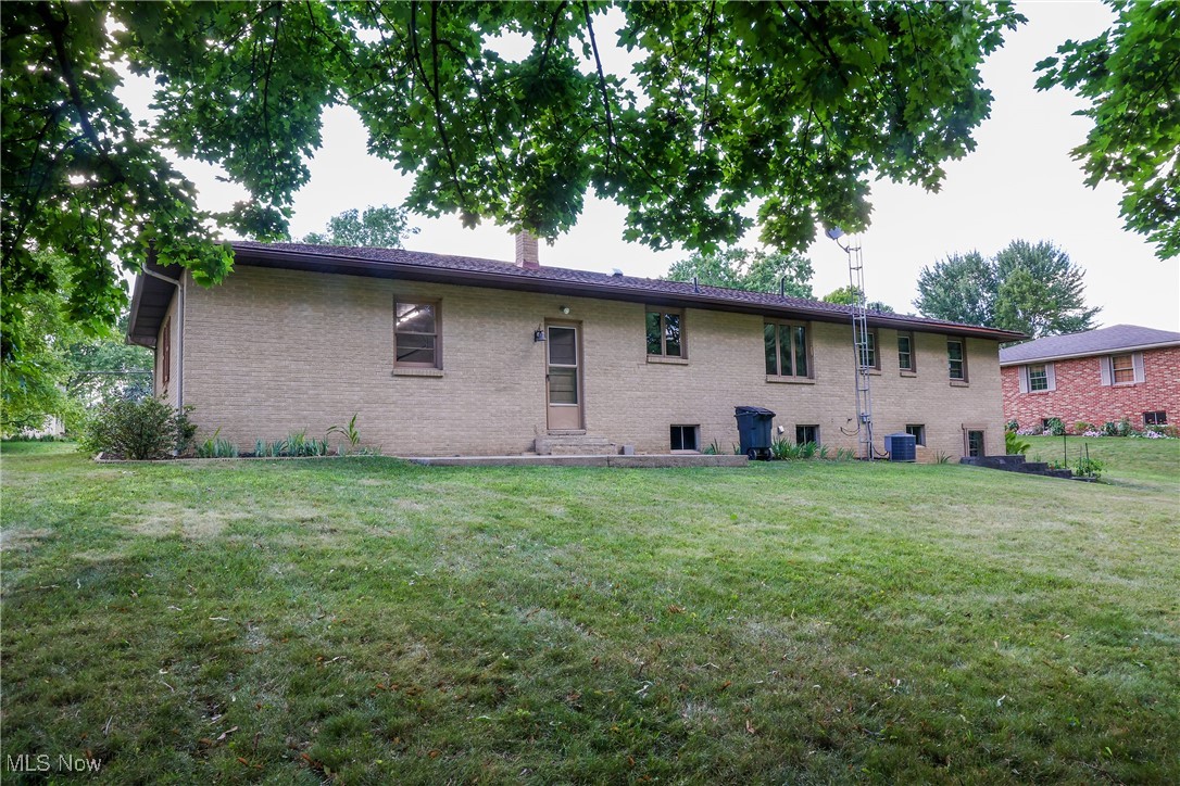 1580 Ruth Drive Wooster, OH 44691 - Photo 3 of 35 Back of property with a yard and central AC