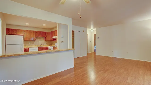 a kitchen with stainless steel appliances a refrigerator and a sink