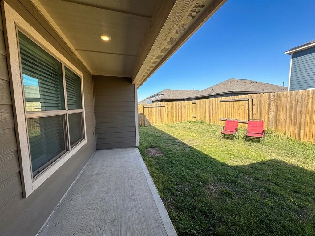13604 Mineral Road Ponder, TX 76259 - Photo 20 of 20 Fenced backyard with a patio