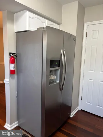a kitchen with sink a window and stainless steel appliances