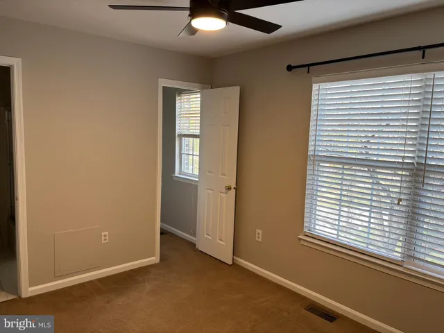 an empty room with closet area