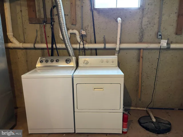 a view of an empty room with wooden walls