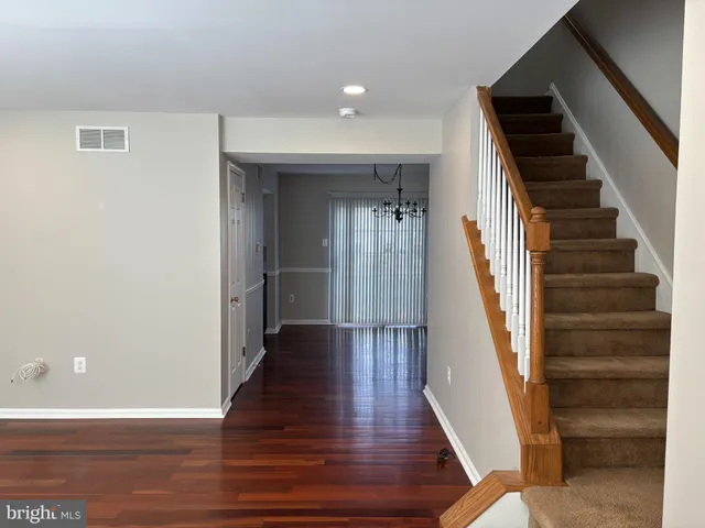 a view of entryway with wooden floor