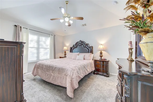 a kitchen with a refrigerator sink and cabinets