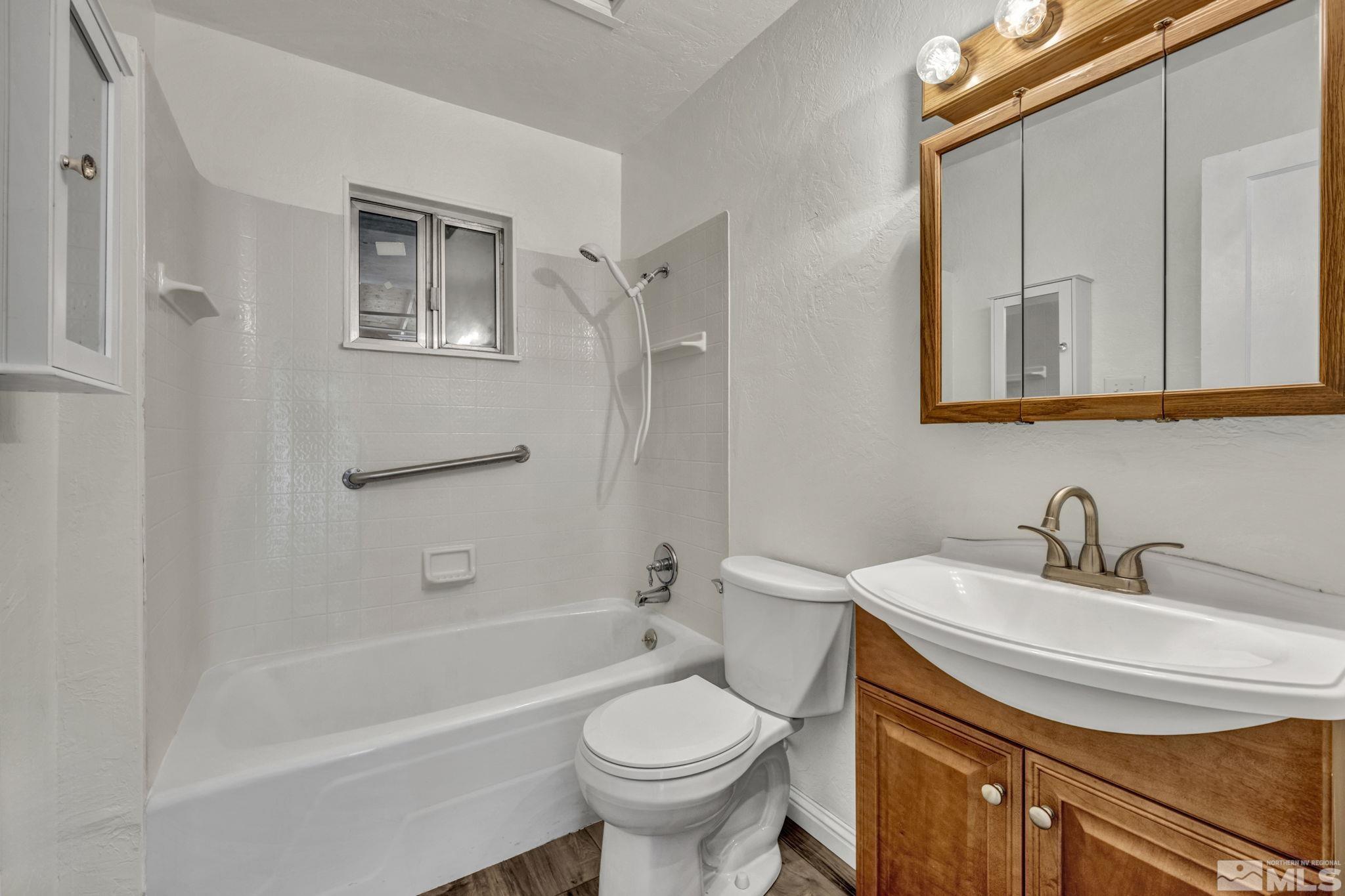 95 East Hwy 95a Yerington, NV 89447 - Photo 29 of 35 a bathroom with a sink a toilet and shower
