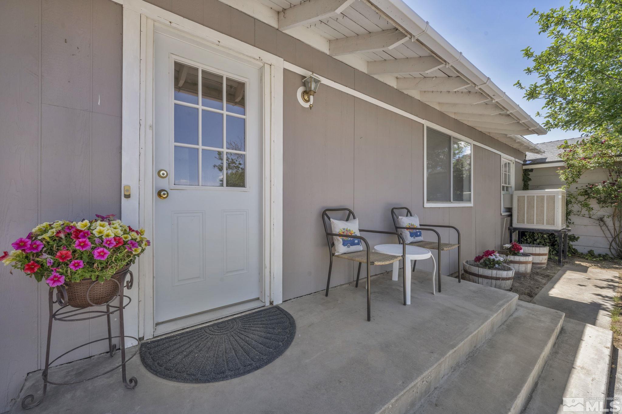 95 East Hwy 95a Yerington, NV 89447 - Photo 9 of 35 a view of a patio with table and chairs and potted plants