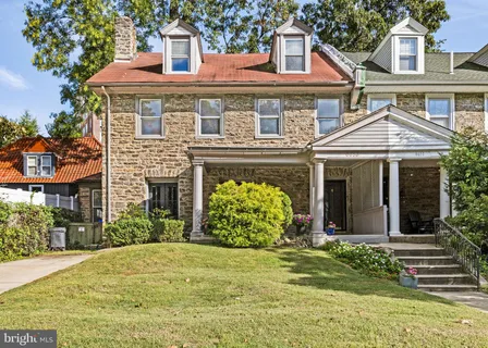 front view of a house with a garden