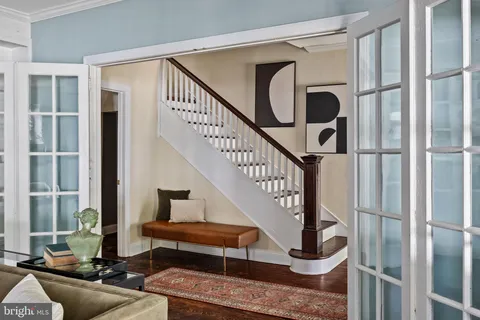 a living room with furniture a fireplace and a window