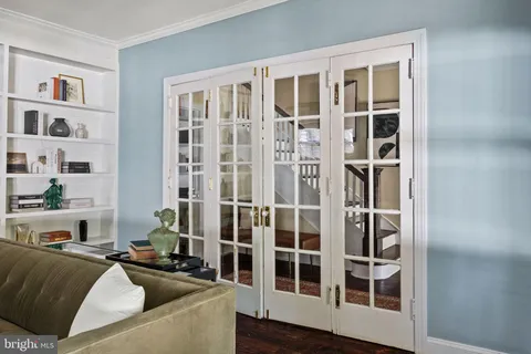 a view of a dining room with furniture and a window