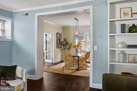 a kitchen with stainless steel appliances granite countertop a sink a stove a counter space and a window
