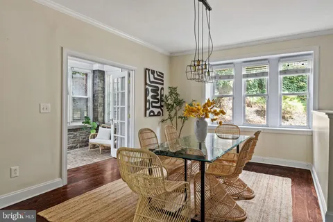 a kitchen with stainless steel appliances granite countertop a sink a counter space and a window