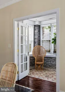 a view of an empty room with closet and bathroom