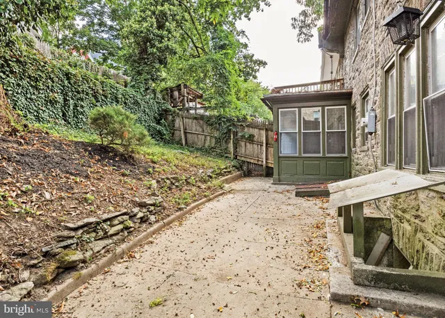 a view of a hallway view with wooden floor and staircase