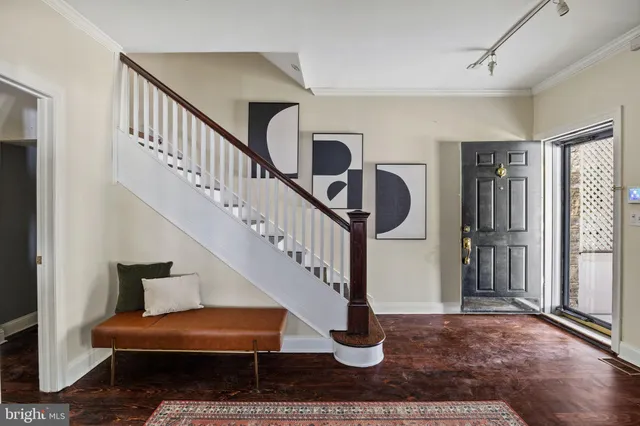 a living room with furniture a fireplace and window