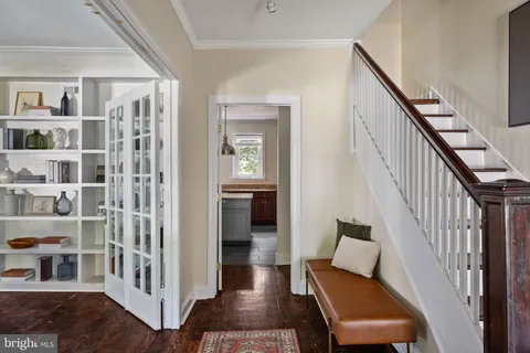 a living room with furniture a rug and a fireplace
