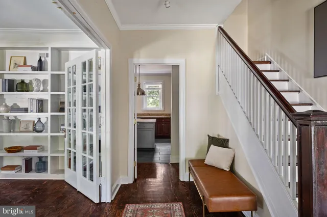 a living room with furniture a rug and a fireplace