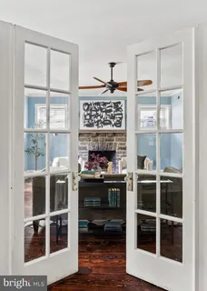 a living room with furniture and a black umbrella