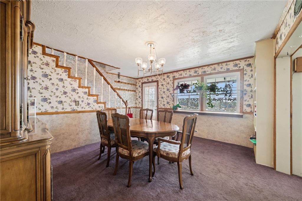 115 Truxall Road Apollo, PA 15613 - Photo 16 of 39 a view of a dining room with furniture window and wooden floor