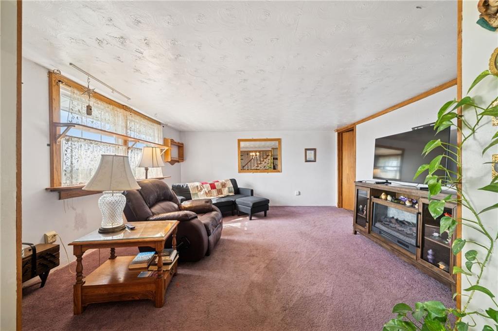 115 Truxall Road Apollo, PA 15613 - Photo 20 of 39 a living room with furniture and a flat screen tv