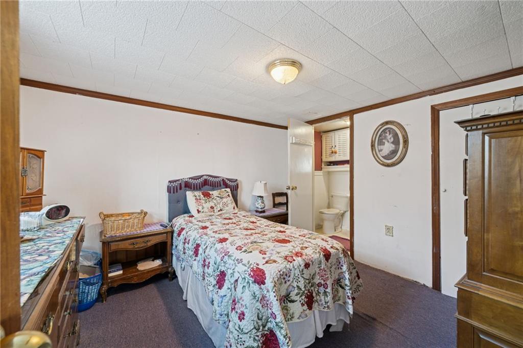 115 Truxall Road Apollo, PA 15613 - Photo 22 of 39 a bedroom with a bed and a chandelier