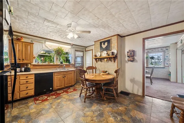 a kitchen with a table and chairs in it