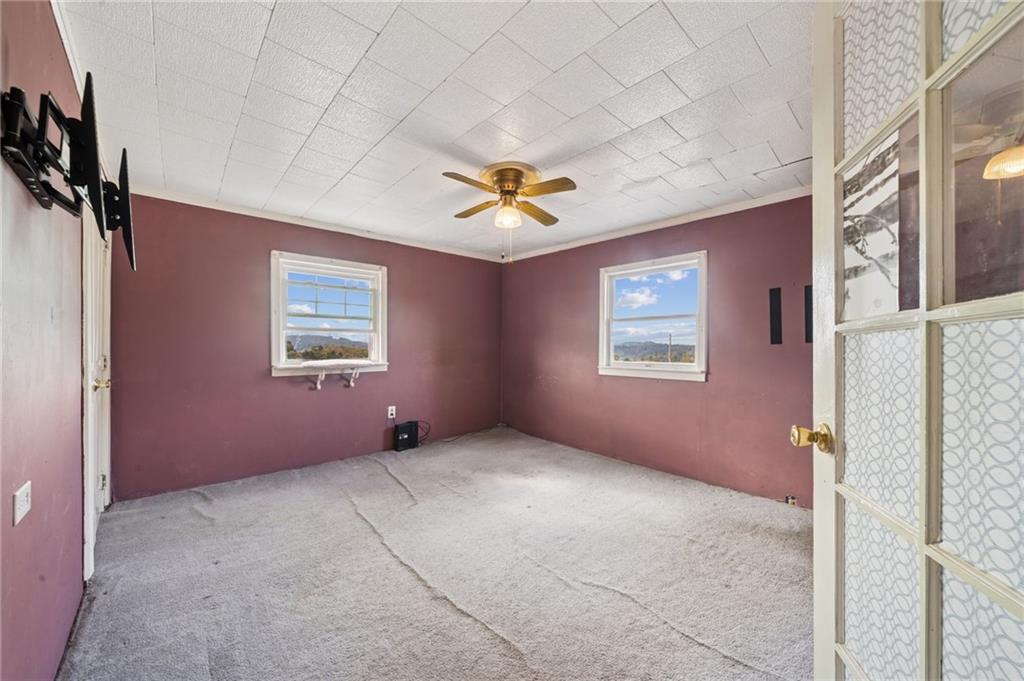 115 Truxall Road Apollo, PA 15613 - Photo 35 of 39 an empty room with windows and fan