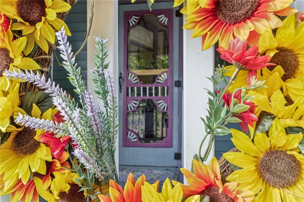 115 Truxall Road Apollo, PA 15613 - Photo 9 of 39 a vase of flowers sitting in front of a door