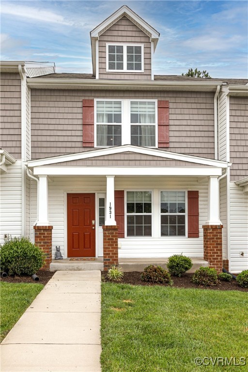 front view of a house with a yard