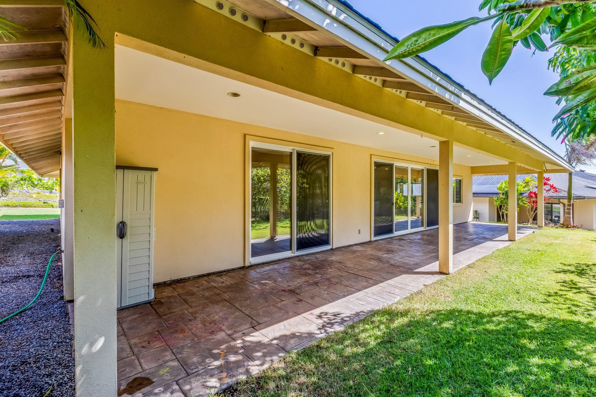 33 Keoneloa Street Wailuku, HI 96793 - Photo 12 of 40 a view of a patio with table and chairs and floor to ceiling window