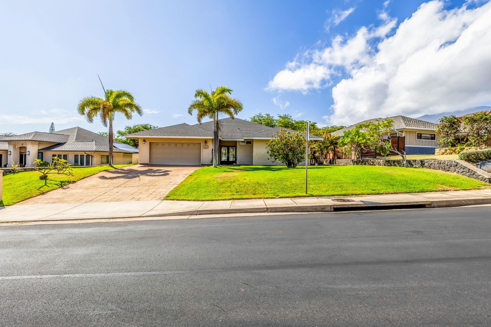 33 Keoneloa Street Wailuku, HI 96793 - Photo 15 of 40 a view of yard with swimming pool and tall buildings in the background