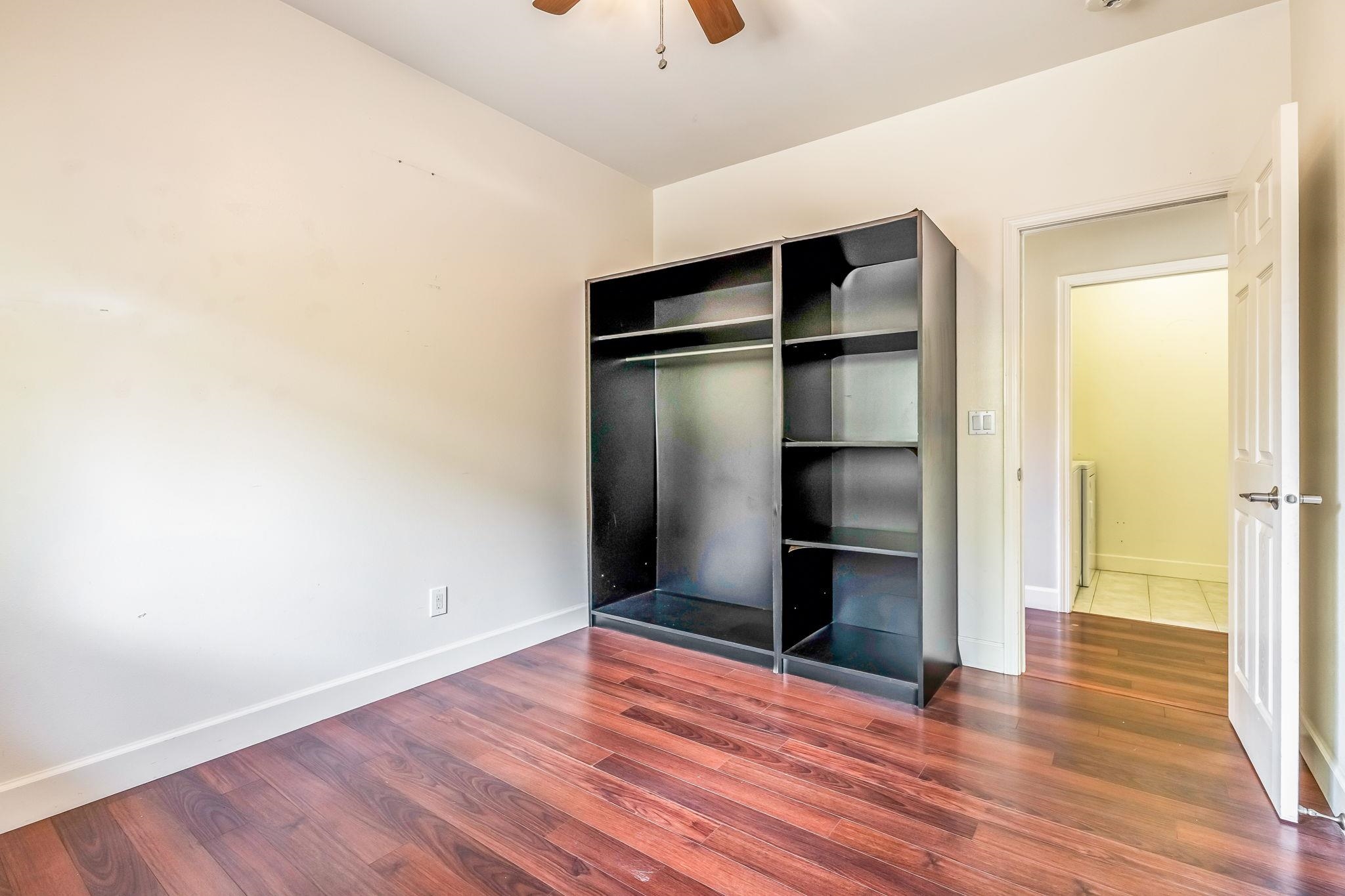 33 Keoneloa Street Wailuku, HI 96793 - Photo 28 of 40 a view of an empty room with wooden floor