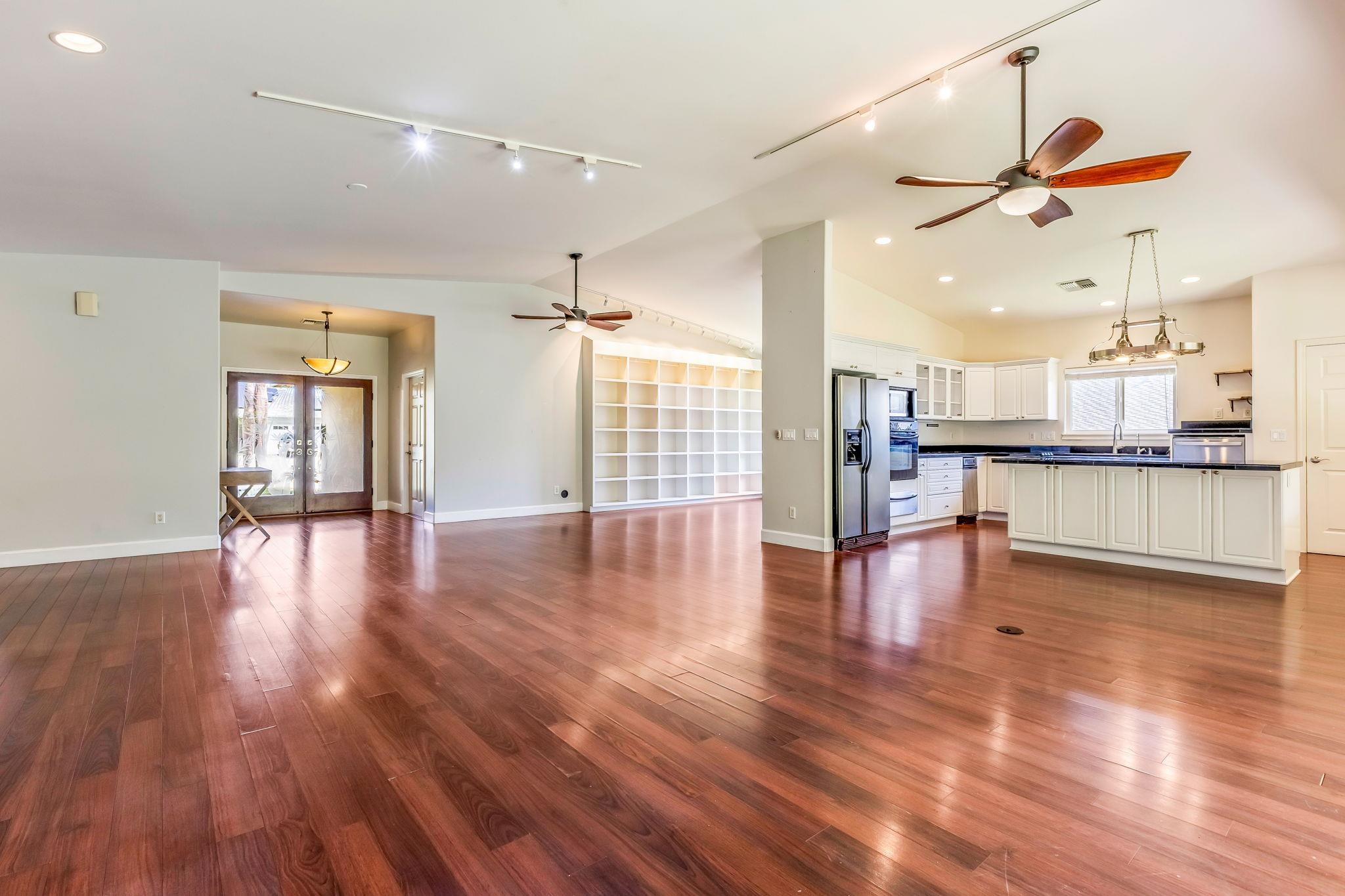 33 Keoneloa Street Wailuku, HI 96793 - Photo 3 of 40 a view of a kitchen with wooden floor and a window