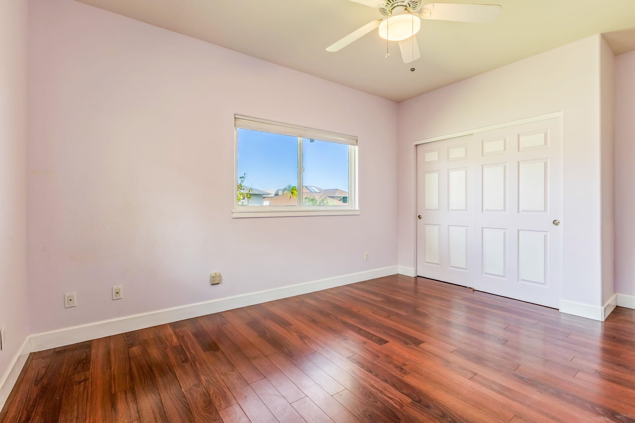 33 Keoneloa Street Wailuku, HI 96793 - Photo 33 of 40 wooden floor in an empty room with a window