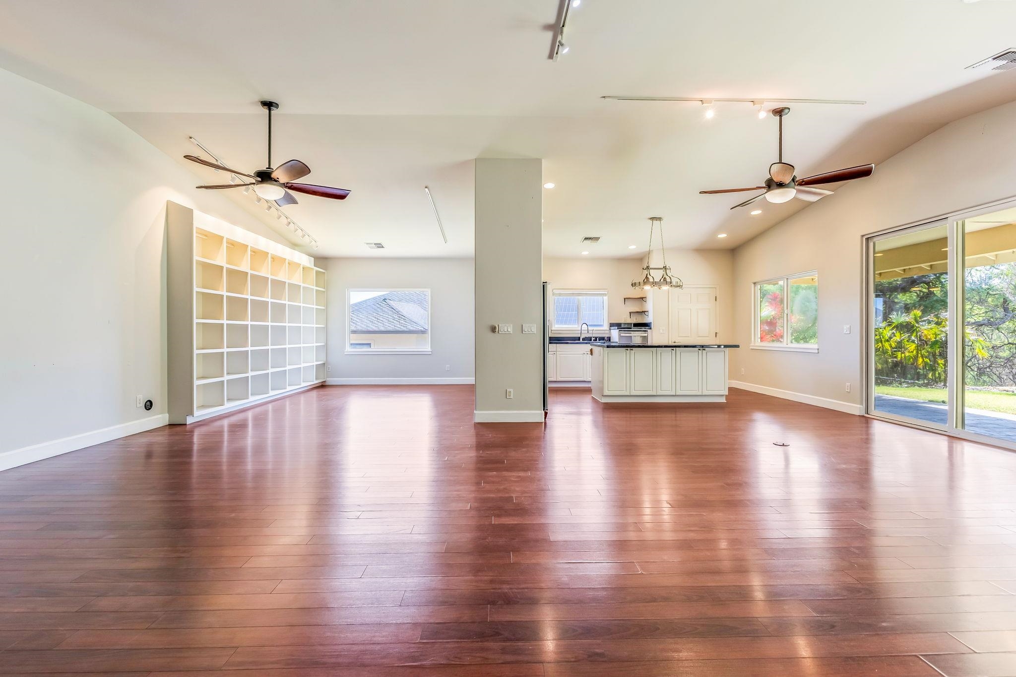 33 Keoneloa Street Wailuku, HI 96793 - Photo 9 of 40 a view of an empty room with wooden floor and a window