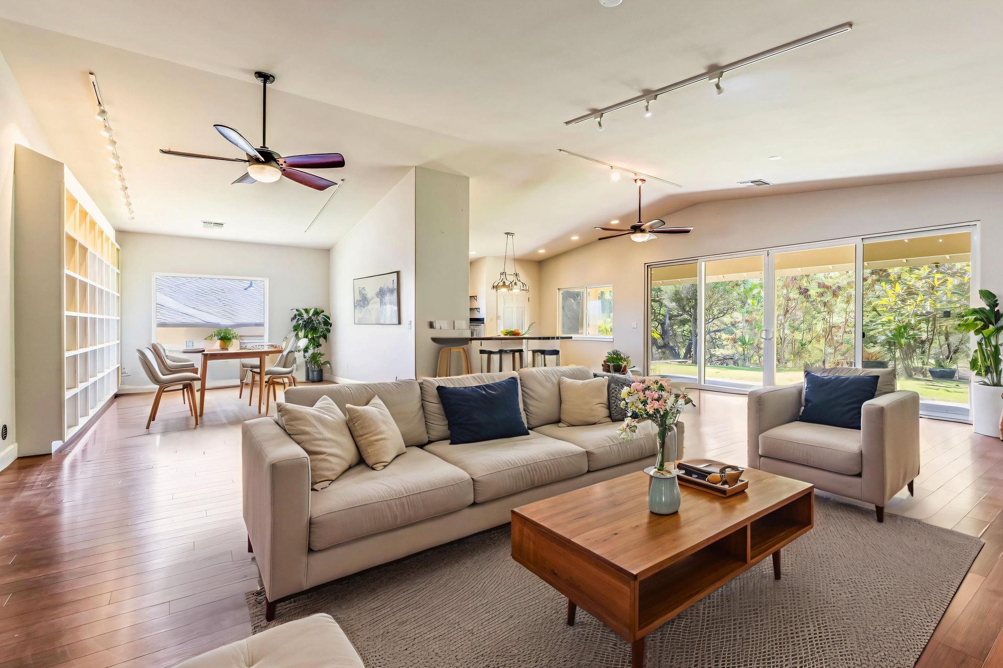 33 Keoneloa Street Wailuku, HI 96793 - Photo 10 of 40 a living room with furniture a ceiling fan and a large window
