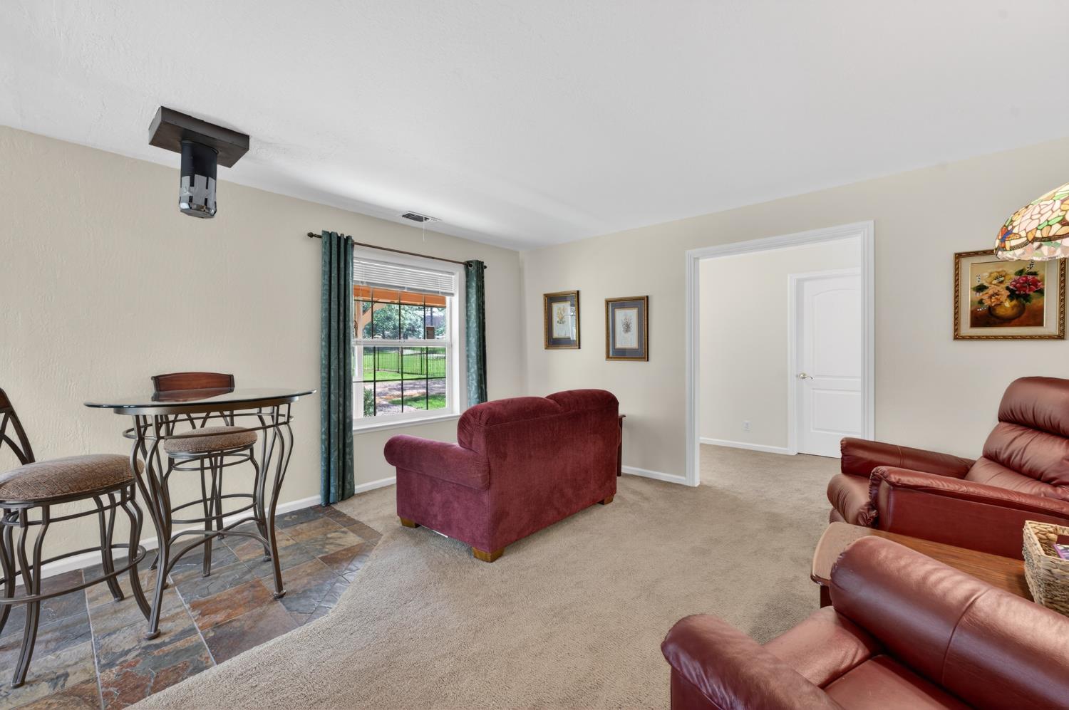26583 Table Meadow Road Auburn, CA 95602 - Photo 18 of 77 a living room with furniture and a window