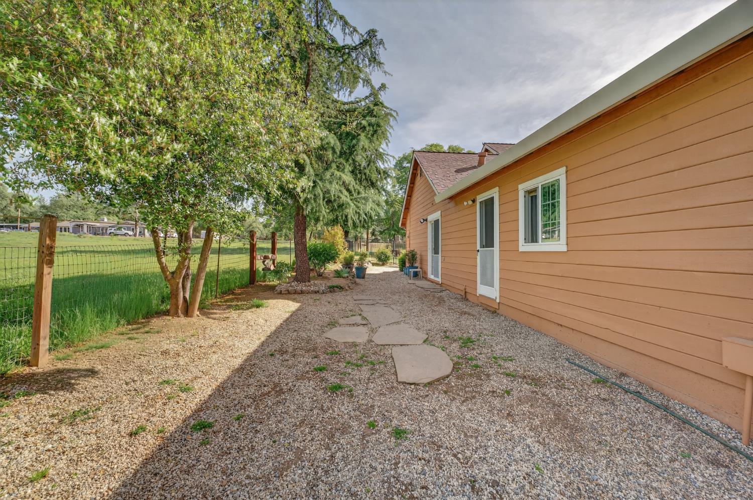 26583 Table Meadow Road Auburn, CA 95602 - Photo 48 of 77 a view of a house with backyard and trees