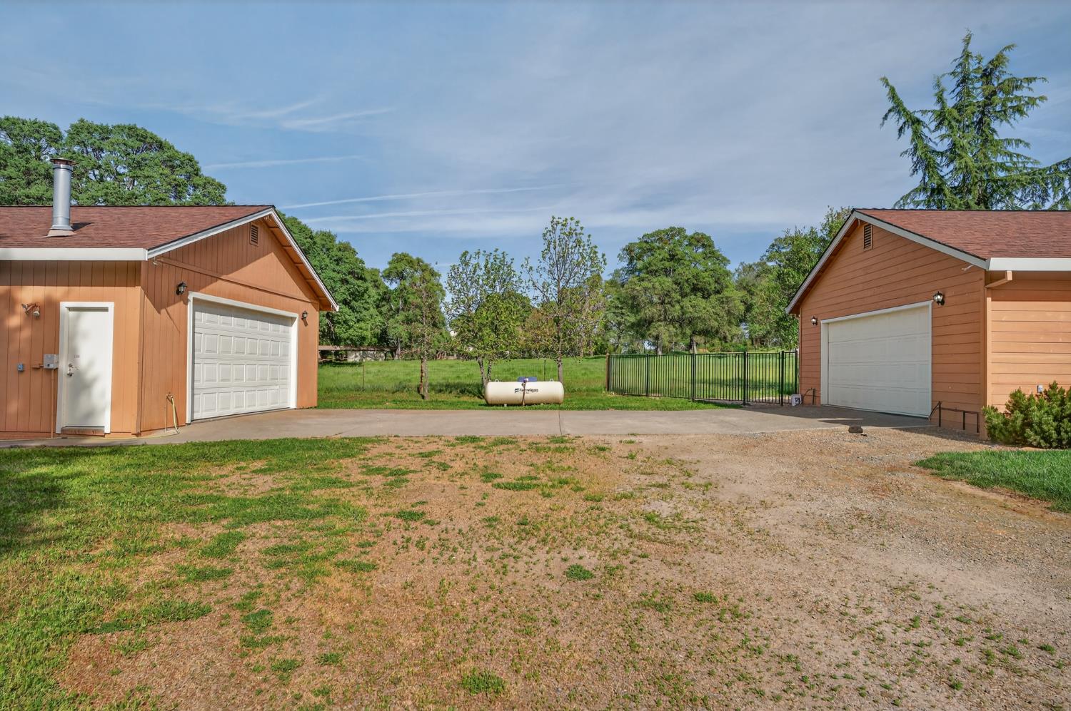26583 Table Meadow Road Auburn, CA 95602 - Photo 61 of 77 a view of a house with a yard and garage