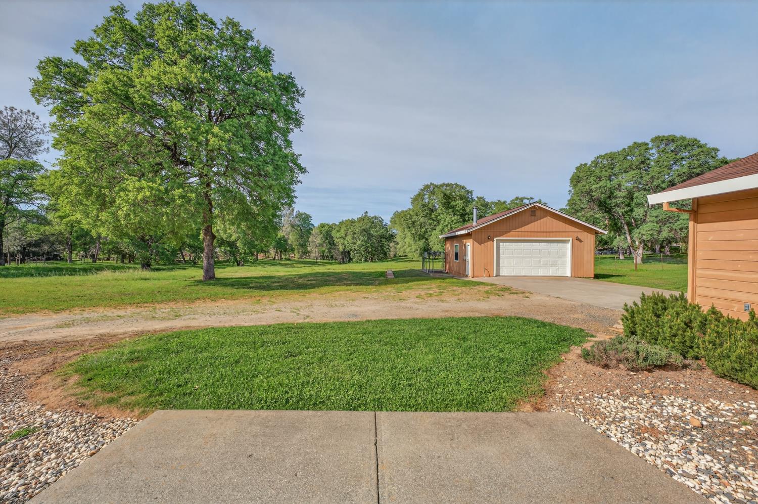 26583 Table Meadow Road Auburn, CA 95602 - Photo 63 of 77 a front view of a house with a yard